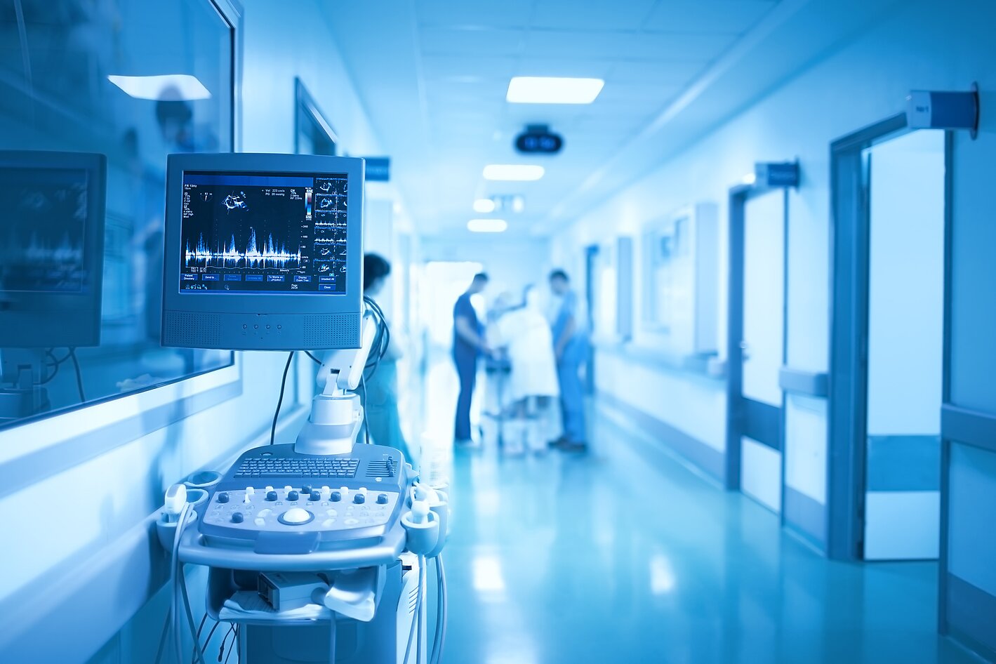 Medical equipment on the background of group of health workers in the ICU