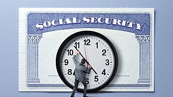Man holding back hands of a clock in front of Social Security card