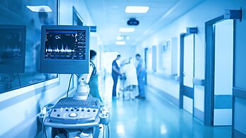 Medical equipment on the background of group of health workers in the ICU