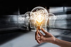 Lightbulb Being Held to Symbolize Ideas and Innovation